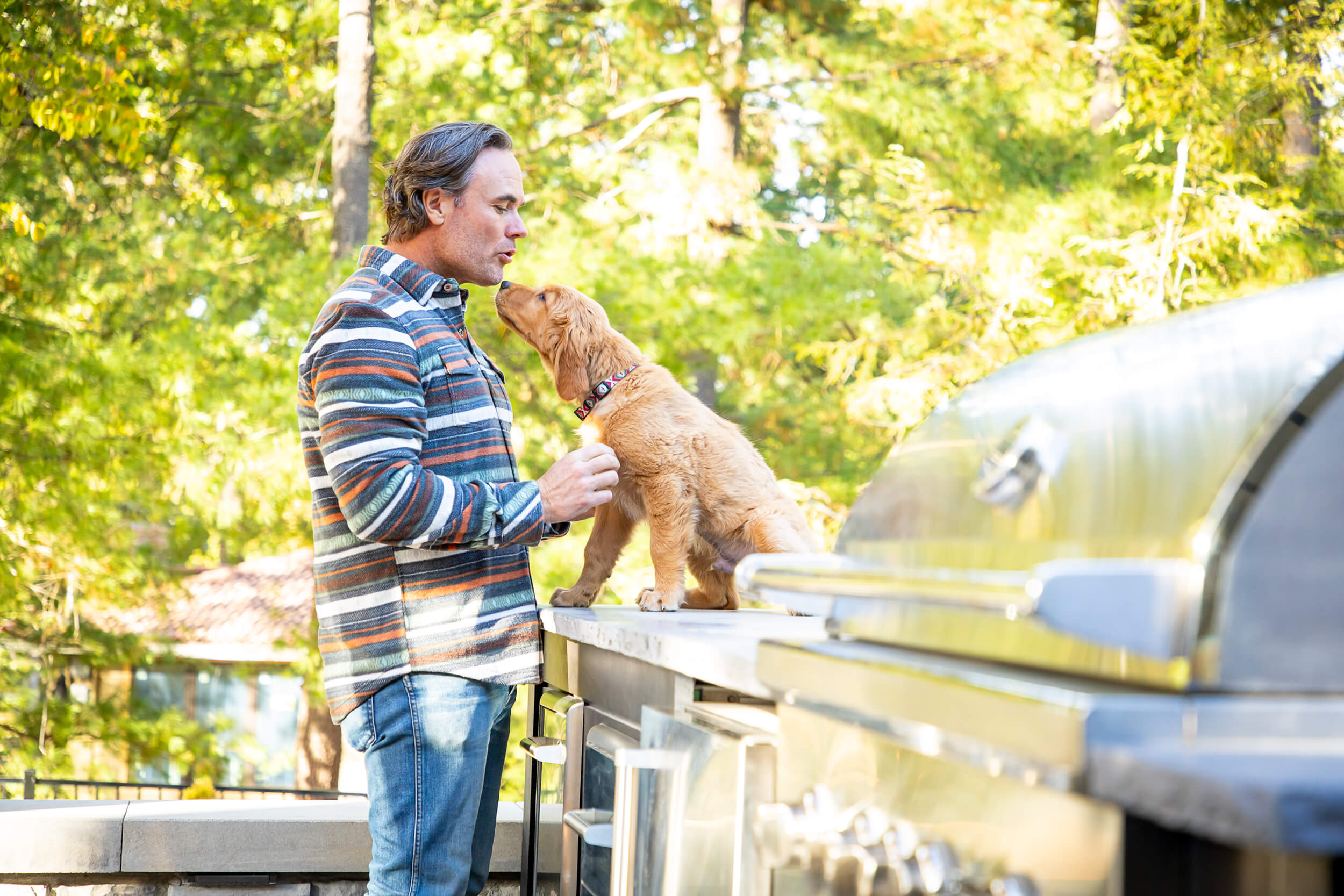 Man with his dog outside on patio