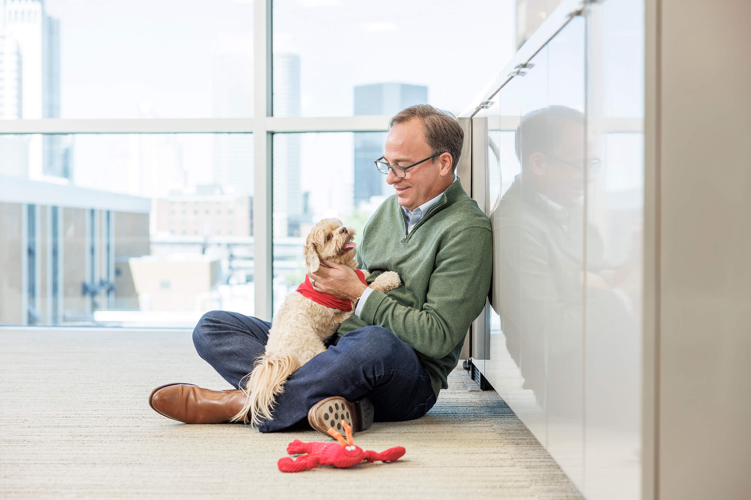 Man smiling at his dog for Purina Brand
