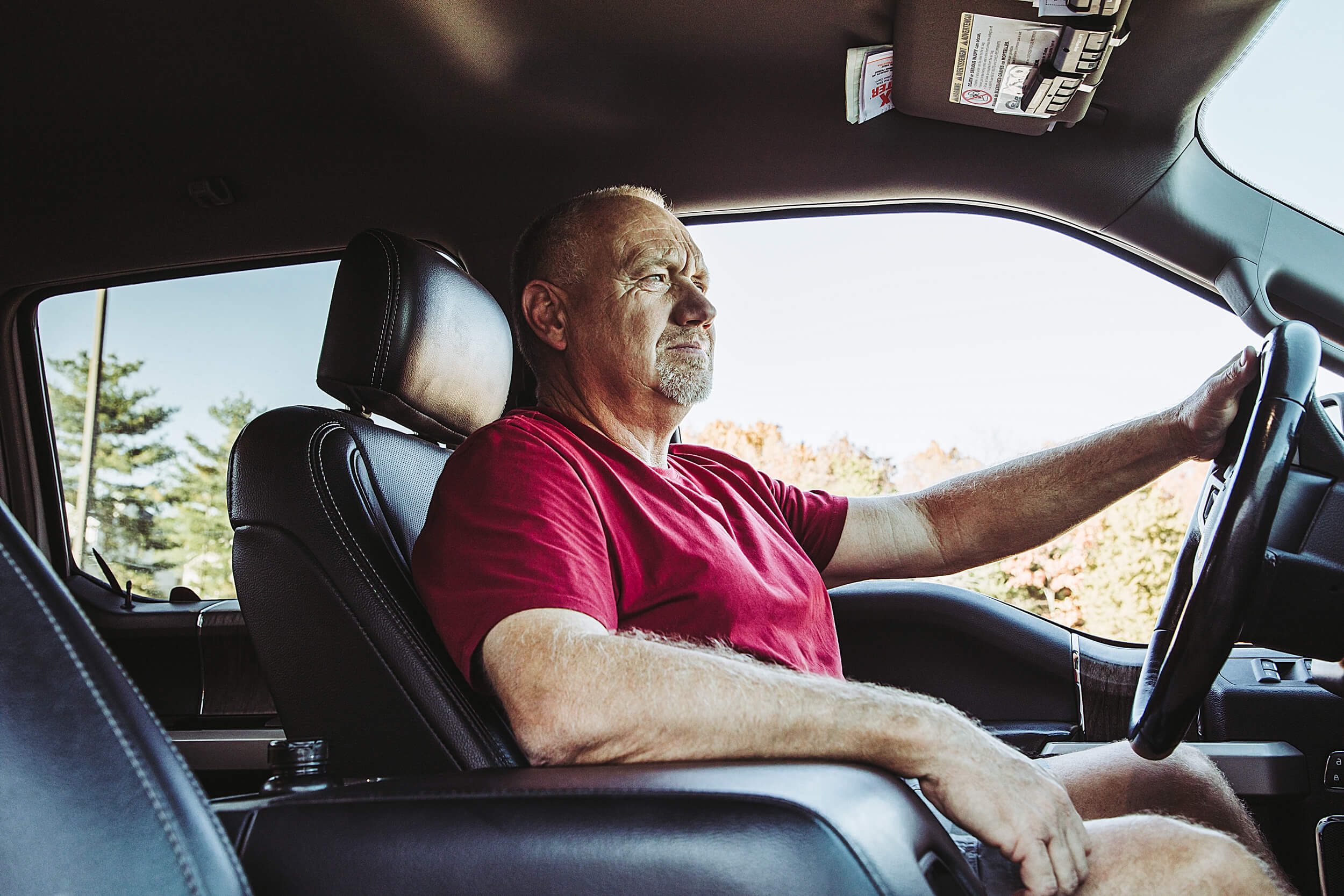 man inside a truck driving