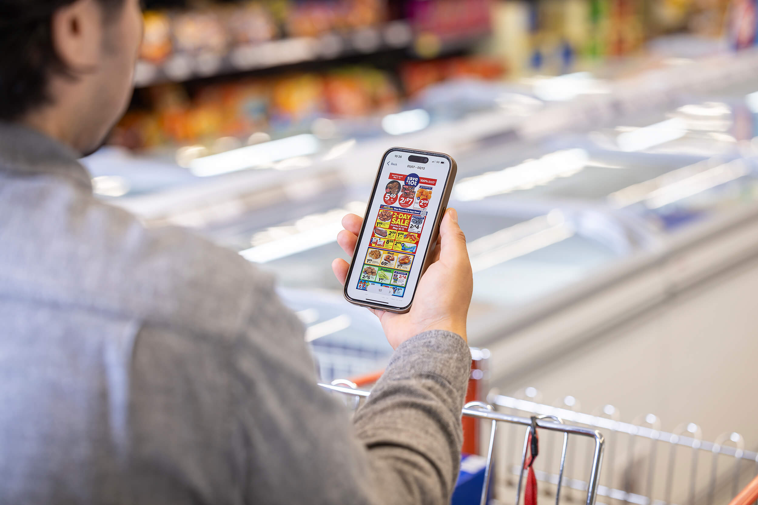 cell phone with grocery store sales on it