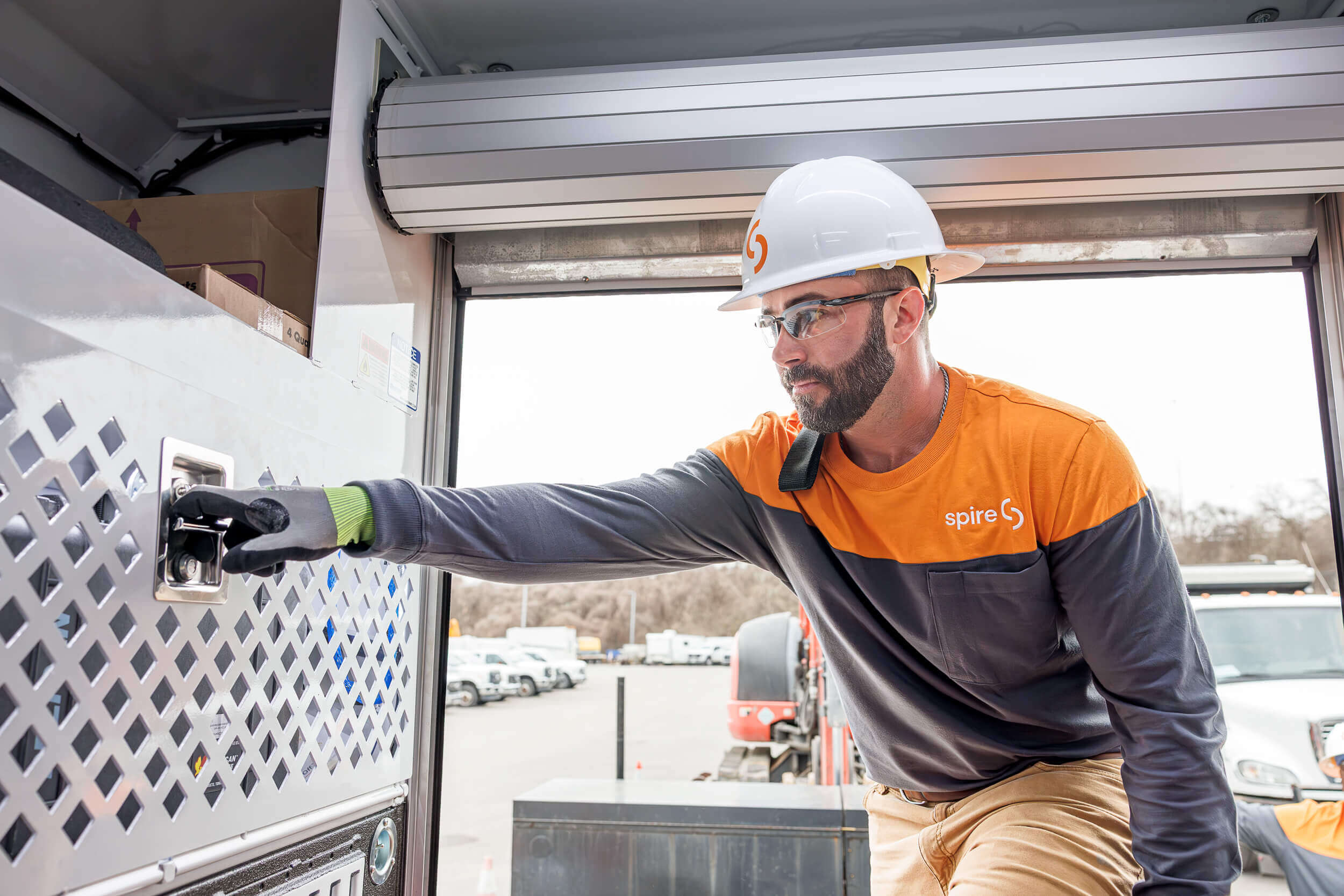 service tech worker looking for equipment in van